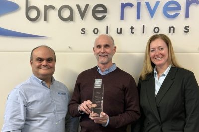 Vin, Jim and Becky holding award